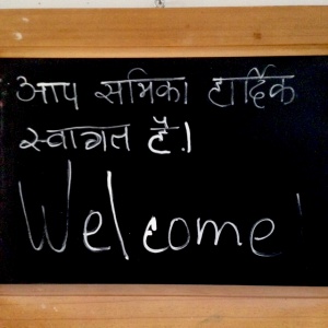 Hindi-English welcome at Adhisthana