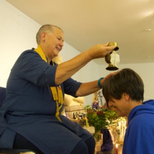 Hadayasiri receives the drops of purification
