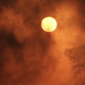 Red sun in clouds