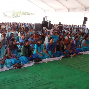 Women sitting in a row for Mitra Ceremony