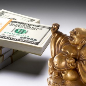 Buddha and dollar bills