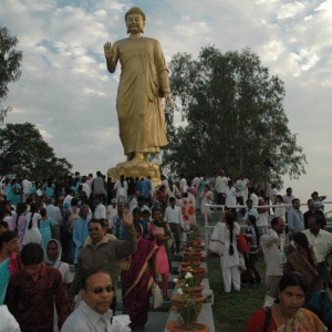 The 'Walking Buddha' statue with crowds